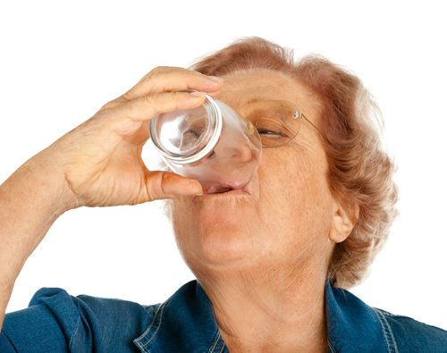 Elder Woman Drinking Water